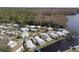 Aerial view of a large waterfront community with lush surroundings at 115 Palm Dr, Eustis, FL 32726