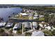 Aerial view of property and surrounding waterfront community at 115 Palm Dr, Eustis, FL 32726