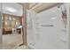 Bathroom with shower stall and grab bars at 115 Palm Dr, Eustis, FL 32726