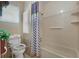 Bathroom with shower/tub combo and grab bars at 115 Palm Dr, Eustis, FL 32726