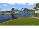 Blue metal bridge over canal leading into waterfront community at 115 Palm Dr, Eustis, FL 32726