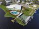 Community clubhouse with pool, shuffleboard, and waterfront access at 115 Palm Dr, Eustis, FL 32726