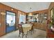 Dining room with wood paneling and built-in cabinetry at 115 Palm Dr, Eustis, FL 32726