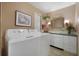 Convenient laundry room with washer and dryer hookups at 115 Palm Dr, Eustis, FL 32726
