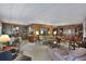 Open living room with wood paneling and comfortable seating at 115 Palm Dr, Eustis, FL 32726