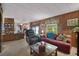 Living room with wood paneling, sofa and recliner at 115 Palm Dr, Eustis, FL 32726