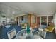 Bright sunroom with wicker furniture and glass walls at 115 Palm Dr, Eustis, FL 32726