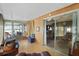 Sunroom with access to backyard and seating at 115 Palm Dr, Eustis, FL 32726