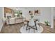 Bright dining area with wood floors and a farmhouse-style table at 1445 Creekside Cir, Winter Springs, FL 32708