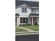 Charming two-story home with a welcoming front porch and landscaped yard at 1691 Eaglehurst Ln, Apopka, FL 32703