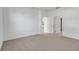 Empty bedroom with neutral carpeting and white walls at 1731 Carnelian St, Deland, FL 32720