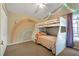 ' bedroom with white bunk beds, rainbow wall art, and whimsical decor at 232 Judith Way, Davenport, FL 33897