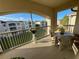 Screened balcony with table and chairs, overlooking the community at 3300 Whitestone Cir # 306, Kissimmee, FL 34741