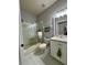 Clean bathroom, white cabinets, shower/tub combo at 3300 Whitestone Cir # 306, Kissimmee, FL 34741
