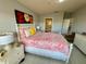 Second bedroom with a floral comforter and white dresser at 3300 Whitestone Cir # 306, Kissimmee, FL 34741