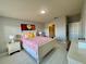 Spacious bedroom with light flooring and en-suite bathroom at 3300 Whitestone Cir # 306, Kissimmee, FL 34741