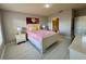 Second bedroom with a floral comforter and white dresser at 3300 Whitestone Cir # 306, Kissimmee, FL 34741