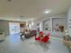 Open living and dining area with modern decor and balcony access at 3300 Whitestone Cir # 306, Kissimmee, FL 34741