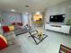 Spacious living room with L-shaped sofa and modern decor at 3300 Whitestone Cir # 306, Kissimmee, FL 34741