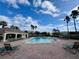 Relaxing community pool area with lounge chairs and cabana at 3300 Whitestone Cir # 306, Kissimmee, FL 34741