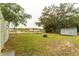 Backyard with storage shed, fire pit, and grassy area at 654 Duncan W Cir, Auburndale, FL 33823