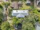 Directly above, bird's eye view of home's metal roof and landscaping at 735 Maryland Ave, Winter Park, FL 32789