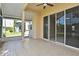 Screened patio with tile flooring and view of the backyard at 77 Spring Glen Dr, Debary, FL 32713