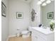 Bathroom with toilet, vanity, and updated fixtures at 8001 Cool Breeze Dr # 121, Orlando, FL 32819
