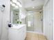 Clean bathroom with a shower, vanity, and plenty of storage at 8001 Cool Breeze Dr # 121, Orlando, FL 32819