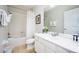 Bathroom with shower/tub combo, vanity, and linen closet at 8001 Cool Breeze Dr # 121, Orlando, FL 32819