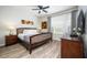 Spacious bedroom with king-size bed, wood flooring, and plenty of natural light at 8001 Cool Breeze Dr # 121, Orlando, FL 32819