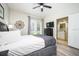 Bedroom with a queen bed, private bathroom, and backyard access at 8001 Cool Breeze Dr # 121, Orlando, FL 32819