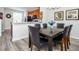 Dining area with a dark brown table and six chairs at 8001 Cool Breeze Dr # 121, Orlando, FL 32819