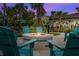 Evening view of community fire pit and seating at 8001 Cool Breeze Dr # 121, Orlando, FL 32819