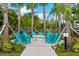 Community fire pit with teal chairs for gatherings at 8001 Cool Breeze Dr # 121, Orlando, FL 32819
