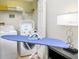 Convenient laundry room with washer, dryer, and ironing board at 8001 Cool Breeze Dr # 121, Orlando, FL 32819