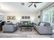 Spacious living room with gray sofas and a coffee table at 8001 Cool Breeze Dr # 121, Orlando, FL 32819