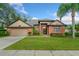 Attractive brick home with a two-car garage and lush landscaping at 1189 Hollow Pine Dr, Oviedo, FL 32765