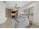 Living room with fireplace and large windows at 1189 Hollow Pine Dr, Oviedo, FL 32765