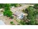 Aerial view of a house with a deck and trees at 1413 Dorothy Ave, Haines City, FL 33844