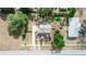 An aerial view of a house with a gray roof and a driveway at 1413 Dorothy Ave, Haines City, FL 33844