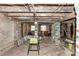 Unfinished basement with exposed brick walls and wooden beams at 1413 Dorothy Ave, Haines City, FL 33844