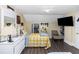Bedroom with a bed, dresser, closet, and mounted television at 1413 Dorothy Ave, Haines City, FL 33844