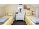Twin bedroom with white furniture and yellow plaid bedding at 1413 Dorothy Ave, Haines City, FL 33844