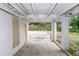 Carport area with concrete driveway and access to the backyard at 1413 Dorothy Ave, Haines City, FL 33844
