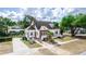 Charming two-story home with a brick and stucco exterior, landscaped yard, and driveway at 1413 Dorothy Ave, Haines City, FL 33844
