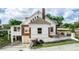 Two-story home with brick and white exterior, carport, and landscaped yard at 1413 Dorothy Ave, Haines City, FL 33844