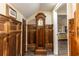 Hallway with a grandfather clock and wood-paneled walls at 1413 Dorothy Ave, Haines City, FL 33844