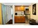 Compact kitchen equipped with essential appliances and ample cabinetry at 1413 Dorothy Ave, Haines City, FL 33844