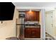 Kitchenette with stainless steel appliances, microwave, and wooden cabinets at 1413 Dorothy Ave, Haines City, FL 33844